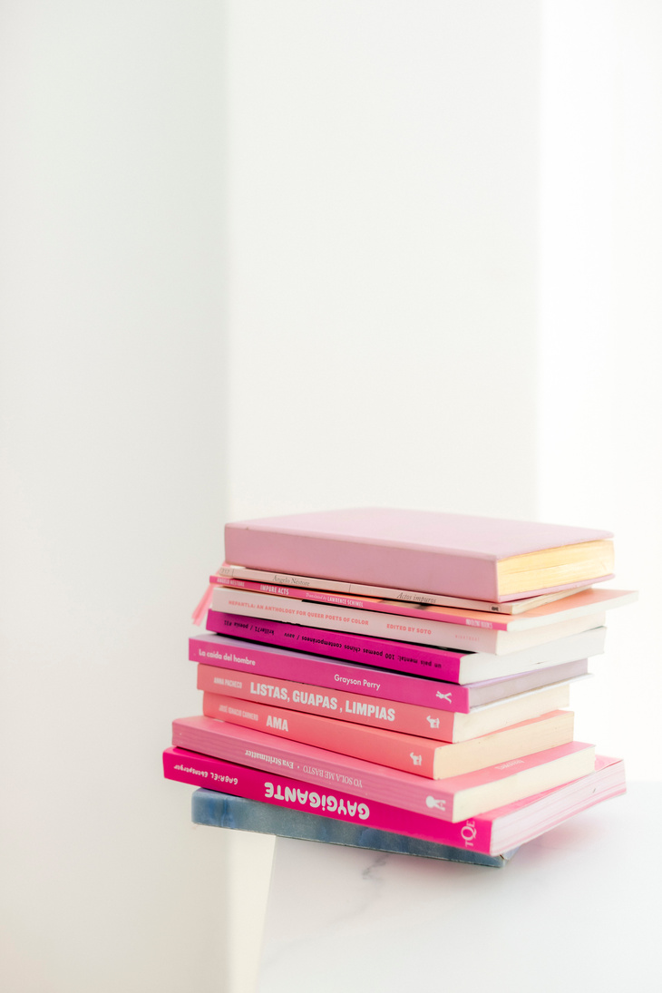 Stack of Books on White Table