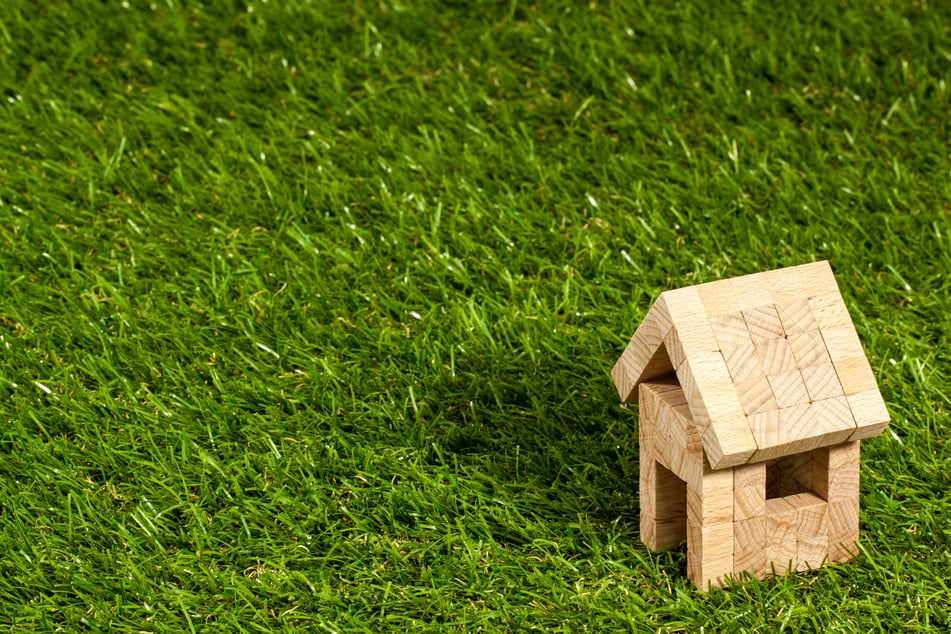 Mini Wooden House on Grass